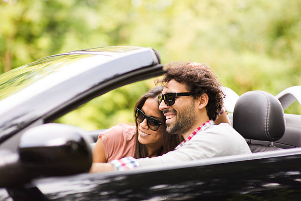 istock Young lovers smiling at a fancy car 179404974