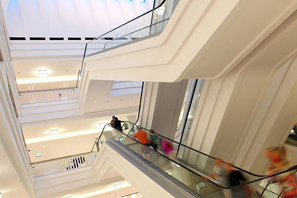 istock People on escalator in shopping mall. 179405104