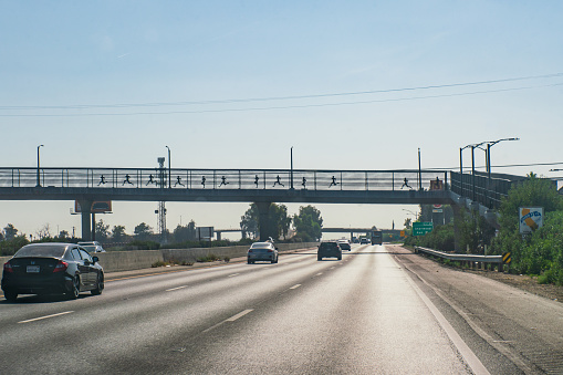 A large overhead highway sign leads drivers to Raleigh and/or Durham, NC, USA.