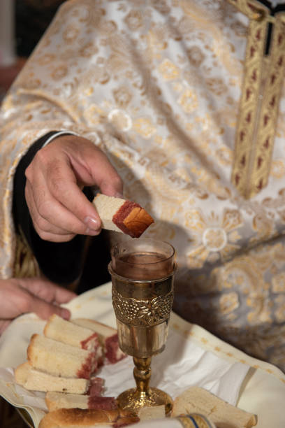 istock consecrated bread into the consecrated wine  in Romania 1794130574