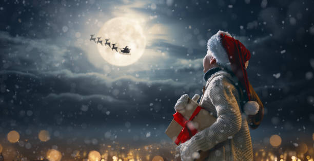 istock girl with present at Christmas 1794138506