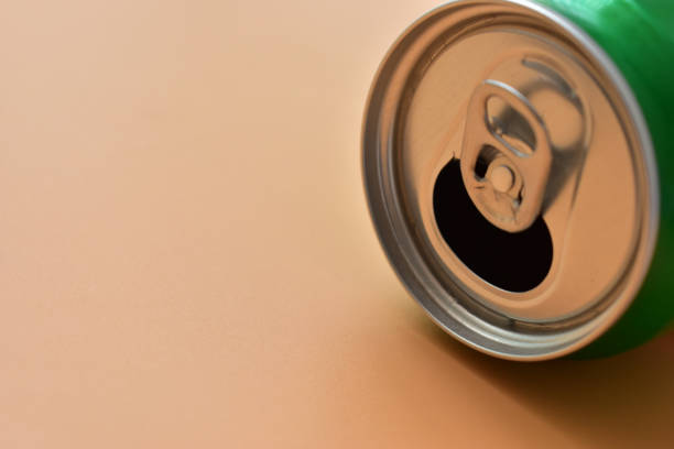 istock aluminum green drink cans on orange background, open cold fresh beverage 1794168517