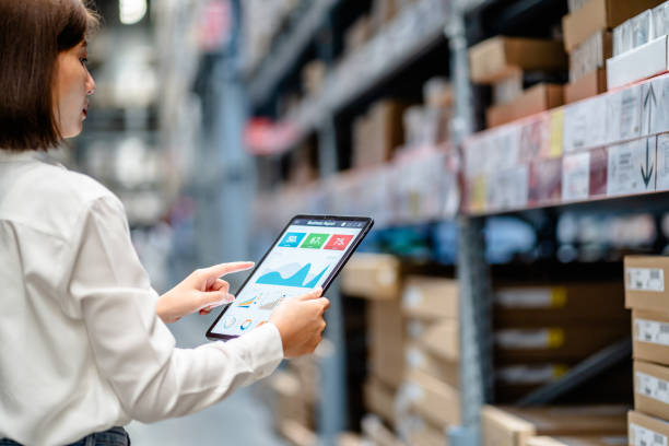 istock Women warehouse worker using digital tablets to check the stock inventory on shelves in large warehouses, a Smart warehouse management system, supply chain and logistic network technology concept 1794178629