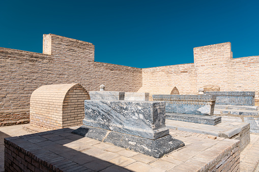 Burial in the necropolis of Chor-Bakr, summer Sunny day, Bukhara, Uzbekistan. Blue sky with copy space for text