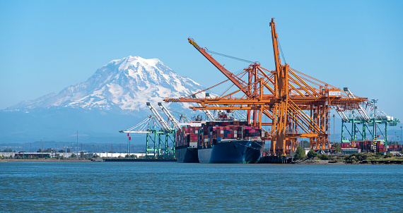 istock two container ships loading at the Port of Tacoma, Washington 1794201233
