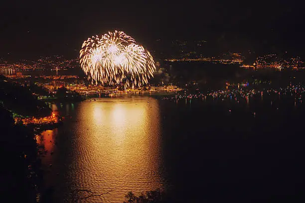 huge fireworks at swiss national holiday 1 august over Ascona, Lago Maggiore