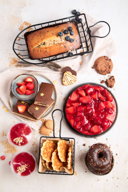 istock Table with various cookies, donuts and cakes. Holiday concept. 1794223717