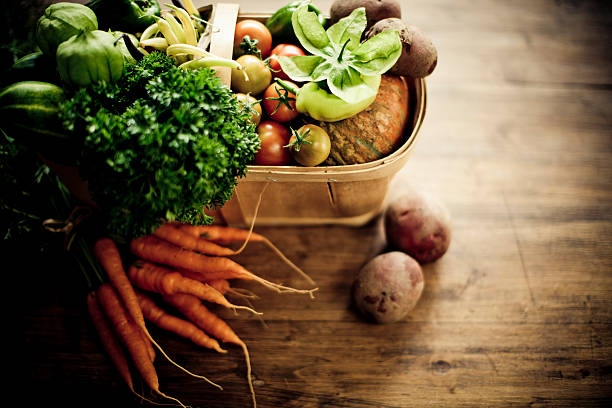 Fresh vegetables in a wooden basket.