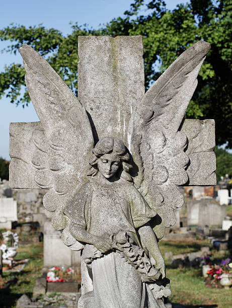 istock Guardian angel in stone on cross 179425598