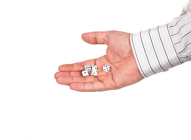 hand with dice on a white background