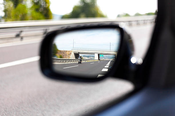 Highway side view mirror reflection I stock photo