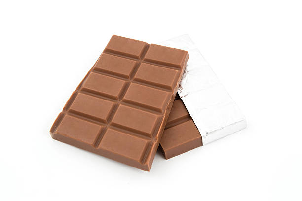 Pieces of chocolate on white background stock photo