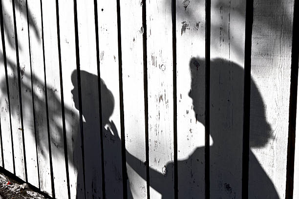 istock shadow of a boy with mother 179426775