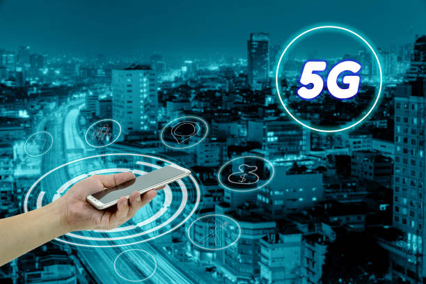 istock hand holding mobile smart phone with cityscape,5G network interface and icon concept 1794281399