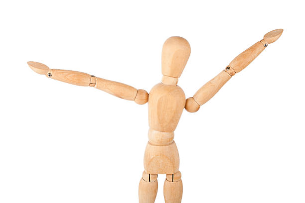 istock Wooden dummy with raised hands 179428760