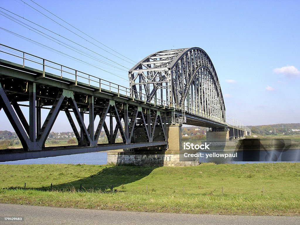 Railway bridge over river Rhine Historical Dutch railway bridge crossing the river Rhine at Oosterbeek, the Netherlands. Famous for its part at the battle of Arnhem during the second World War Arnhem Stock Photo