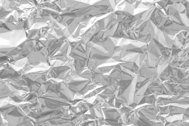 istock Shiny silver foil texture background, pattern of wrapping paper with crumpled and wavy. 1794300777