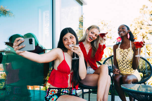 istock Selfie Of Three Multicultural Young Woman Having Fun With Drinks Outdoors In Backyard 1794302962