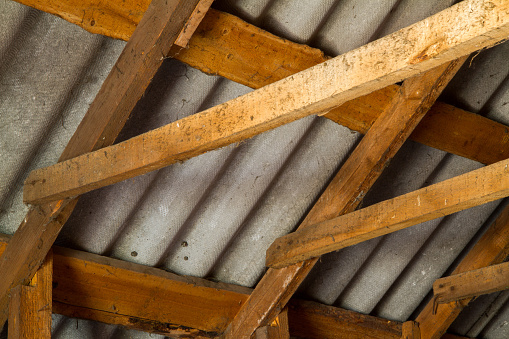 The roof of the country house is from the inside. Wooden floor beams. The old roof is made of slate.