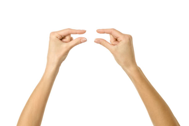 istock Holding or measuring hands. Woman hand gesturing isolated on white 1794306225