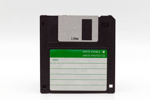 istock Floppy disk of 1.4 megabytes isolated on white background. Old storage disc for computer. Vintage technology. 1794316554