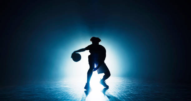 istock Young man dribbling on court 1794334541