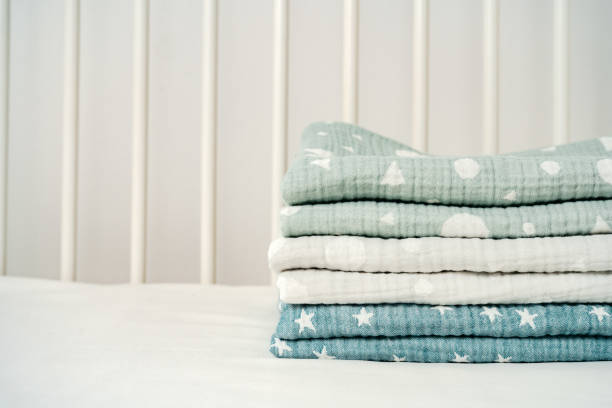 istock Stack of cotton blankets for a newborn in a cradle 1794343757
