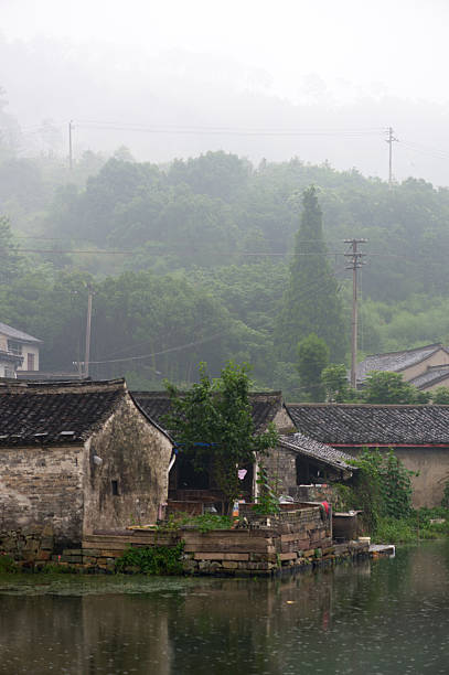 istock Foggy sunset in mountain village 179435454