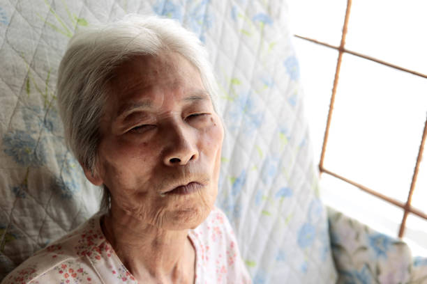 istock Close-up of an elderly woman's face with a depressed expression 1794366309