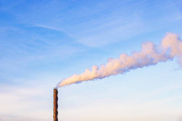 istock Chimney with smoke against a blue sky 1794387169