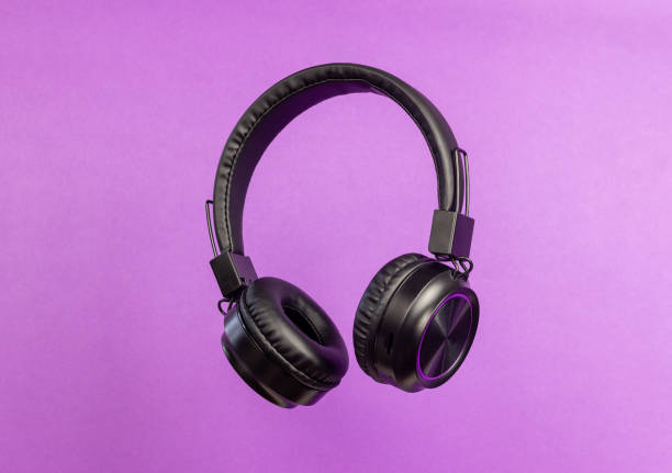 istock Black headphones on a purple background. Minimal concept. 1794388765