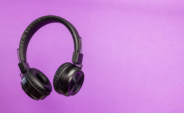 istock Black headphones on a purple background. Minimal concept. 1794388766