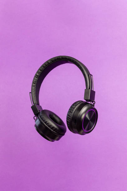 istock Black headphones on a purple background. Minimal concept. 1794388767