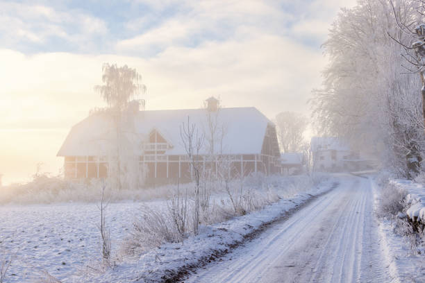 Red barn in the countryside a cold misty winter day