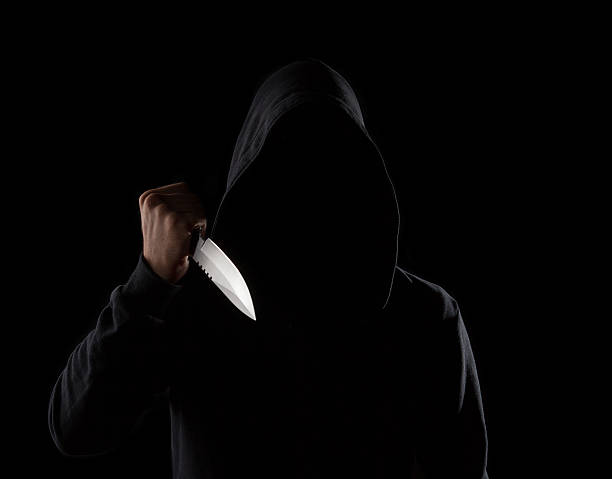 istock Dangerous hooded man holding knife 179440565