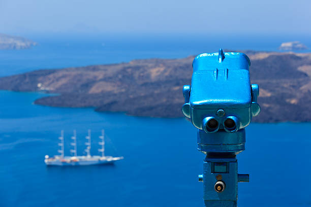 istock Binoculars with volcano view on Santorini island, Greece 179441162