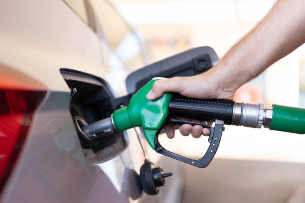 istock Hand refuelling the car in a gas station 1794423620