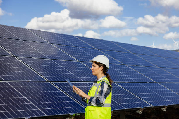 istock Woman engineer working in solar panel power plant 1794444695