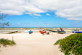 Beach near Niechorze in Poland. Natural coast on the Polish Baltic Sea with white sand and fishing boats. Landscape by the sea.