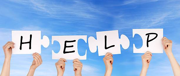 istock hands holding pieces of a puzzle with help 179445859