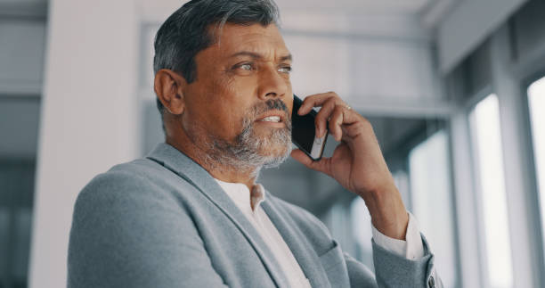 istock Phone call, mature man and ceo talking, conversation or communication in office. Smartphone, serious manager and business discussion of contact listening to news, networking and thinking in company 1794474242