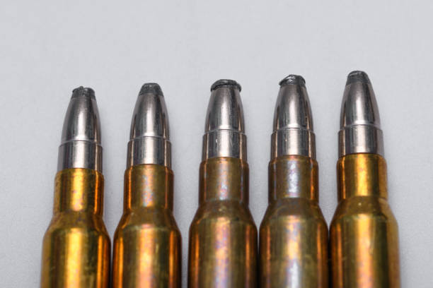 istock Lead bullets in steel cases on a white background 1794495459