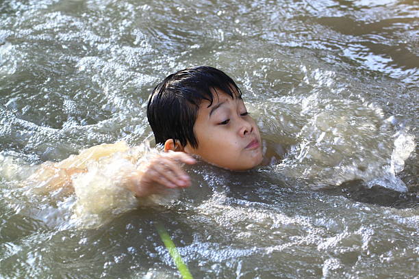 Drowning swimmer seeking rescue. Insurance concept