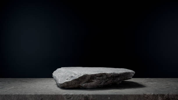 istock Chic Grey Display Stand: Elegant Podium Scene with Stone Accents and Sleek Black Background. 1794520847