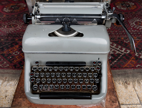 A vintage Arabic language manual typewriter on sale in an antiques shop in the Jaffa flea market in Israel.