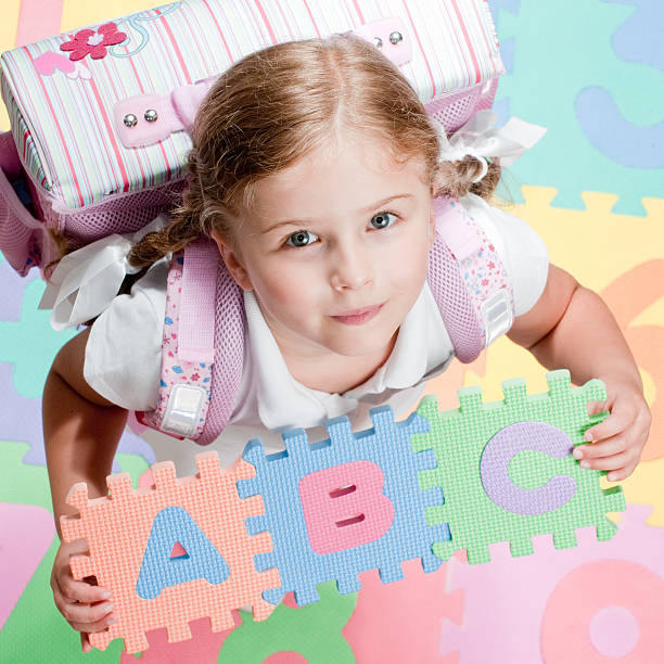 Happy little girl first day at school 