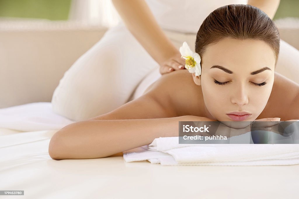 Beautiful woman receiving a spa treatment Spa Woman. Close-up of a Beautiful Woman Getting Spa Treatment. Massage Adult Stock Photo