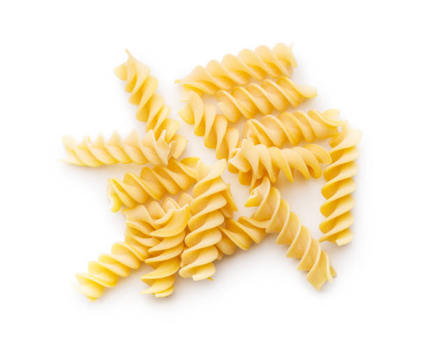 istock Uncooked fusilli pasta. Uncooked italian pasta isolated on white background. 1794538064