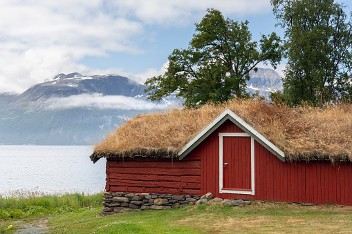 Old Norwegian buildings by the fjord at the Gamslett museum in  Svensby, Lyngen, Northern Norway
