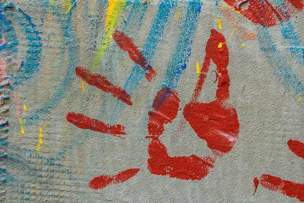 istock White plastered wall splattered with red paint. Paint splashes on the wall. Painted plaster wall. Abstract background. Painted plaster texture 1794542401